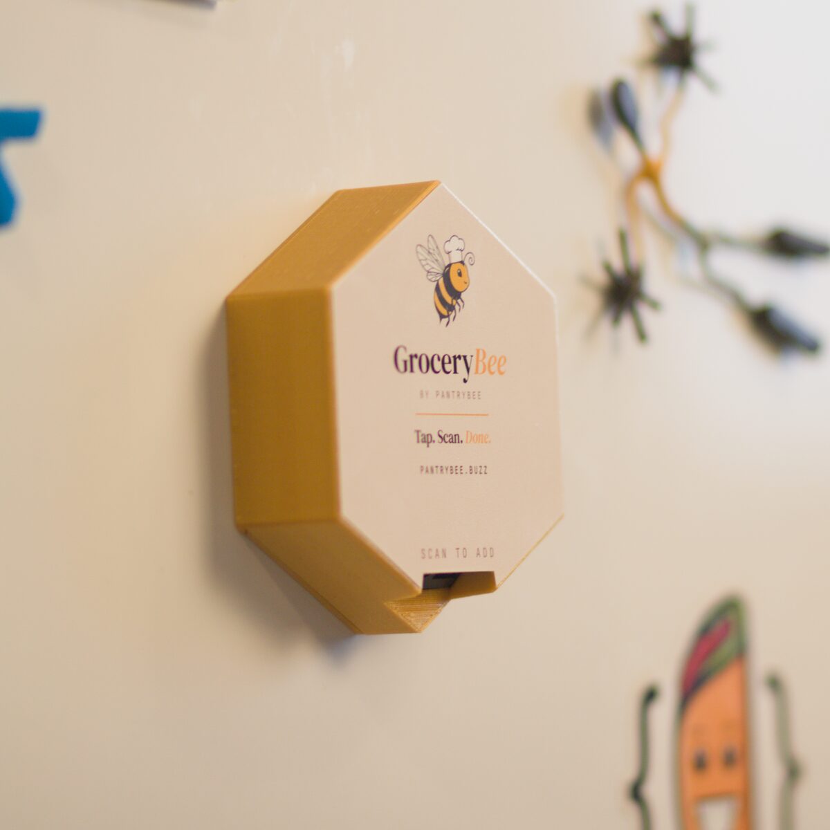 GroceryBee mounted on a fridge door.